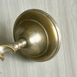 Three metal candle holders, twisted design, patinated finish, vintage style.