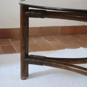 Round coffee table in rattan and smoked glass — 1970s