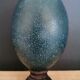 Emu egg naturally green / blue on dark wood bases