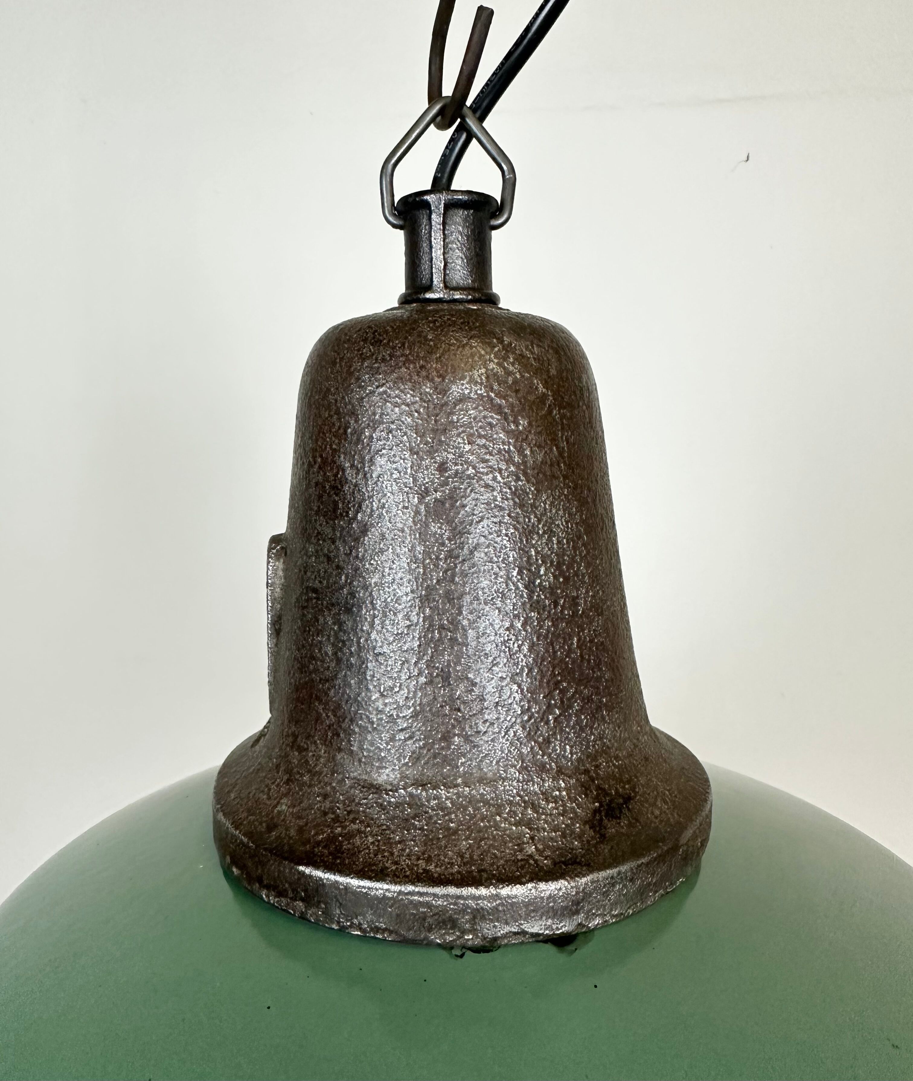 Industrial green enamel factory lamp with cast iron top, 1960s