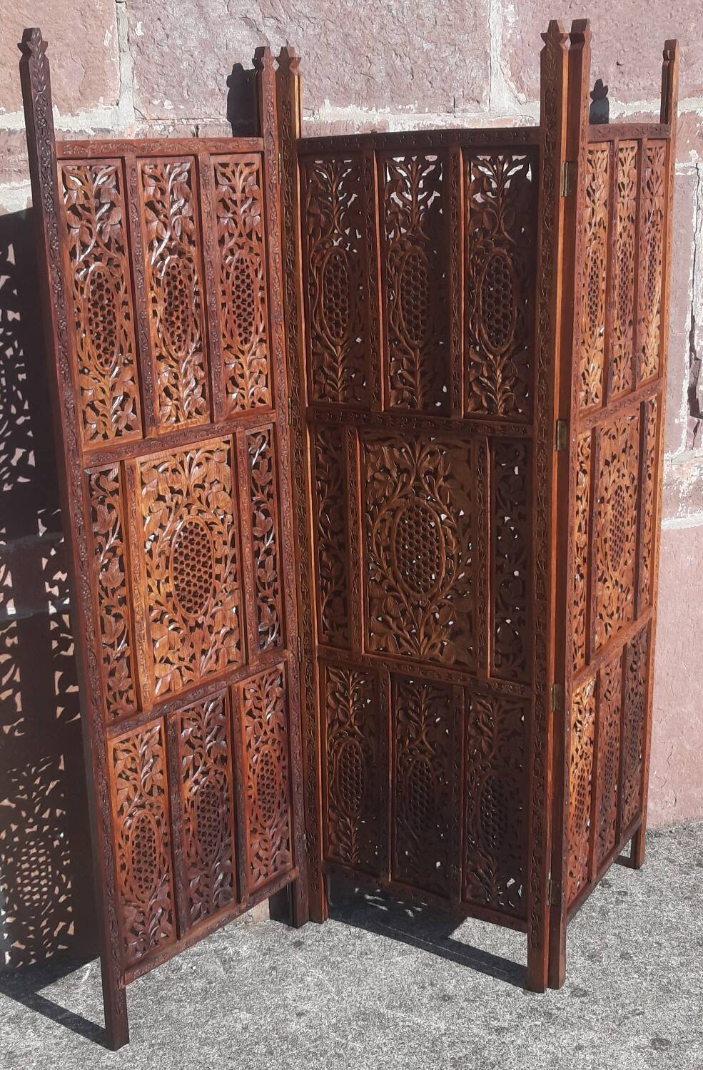 Carved solid wood screen.