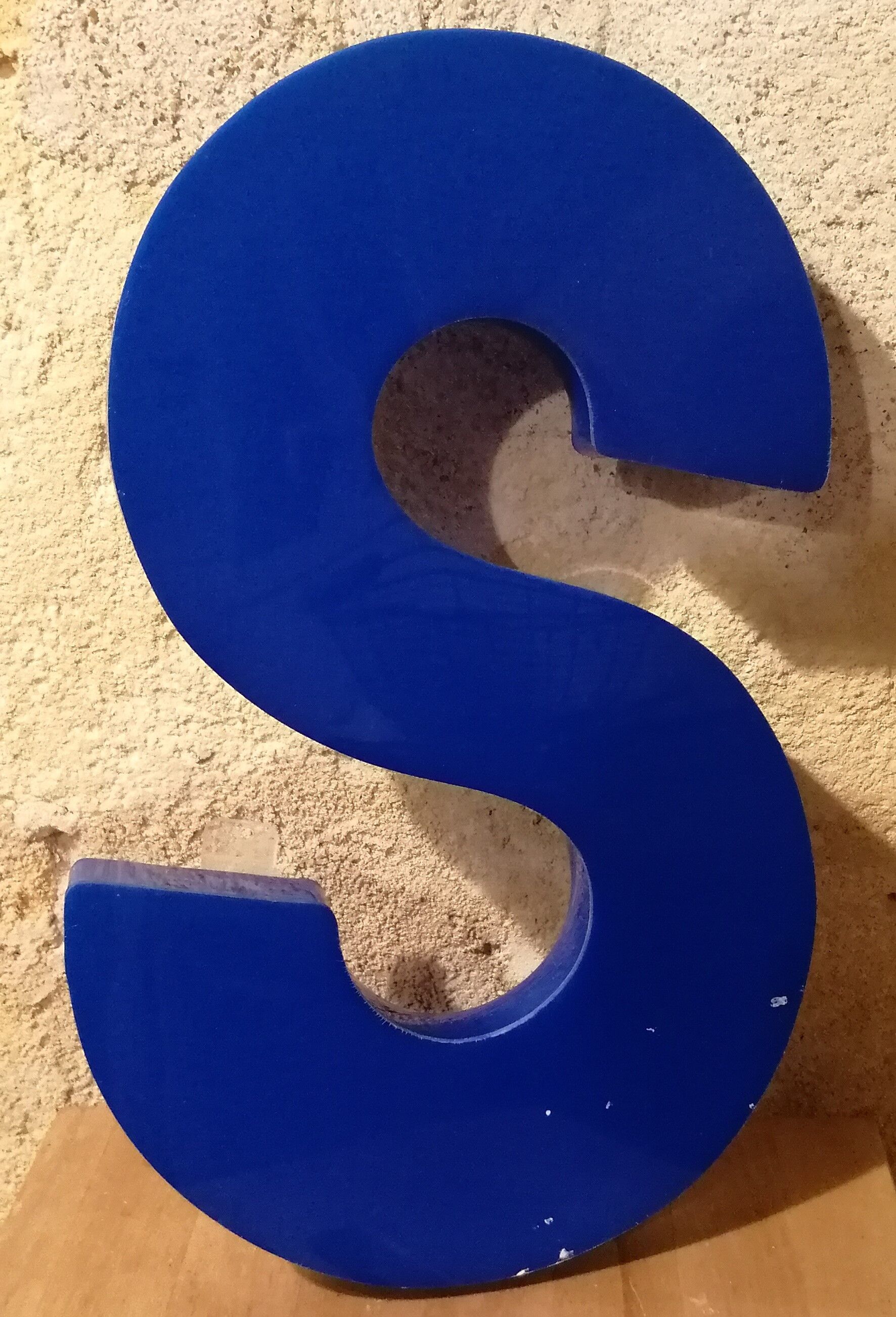 Letter S vintage sign in blue plexiglass