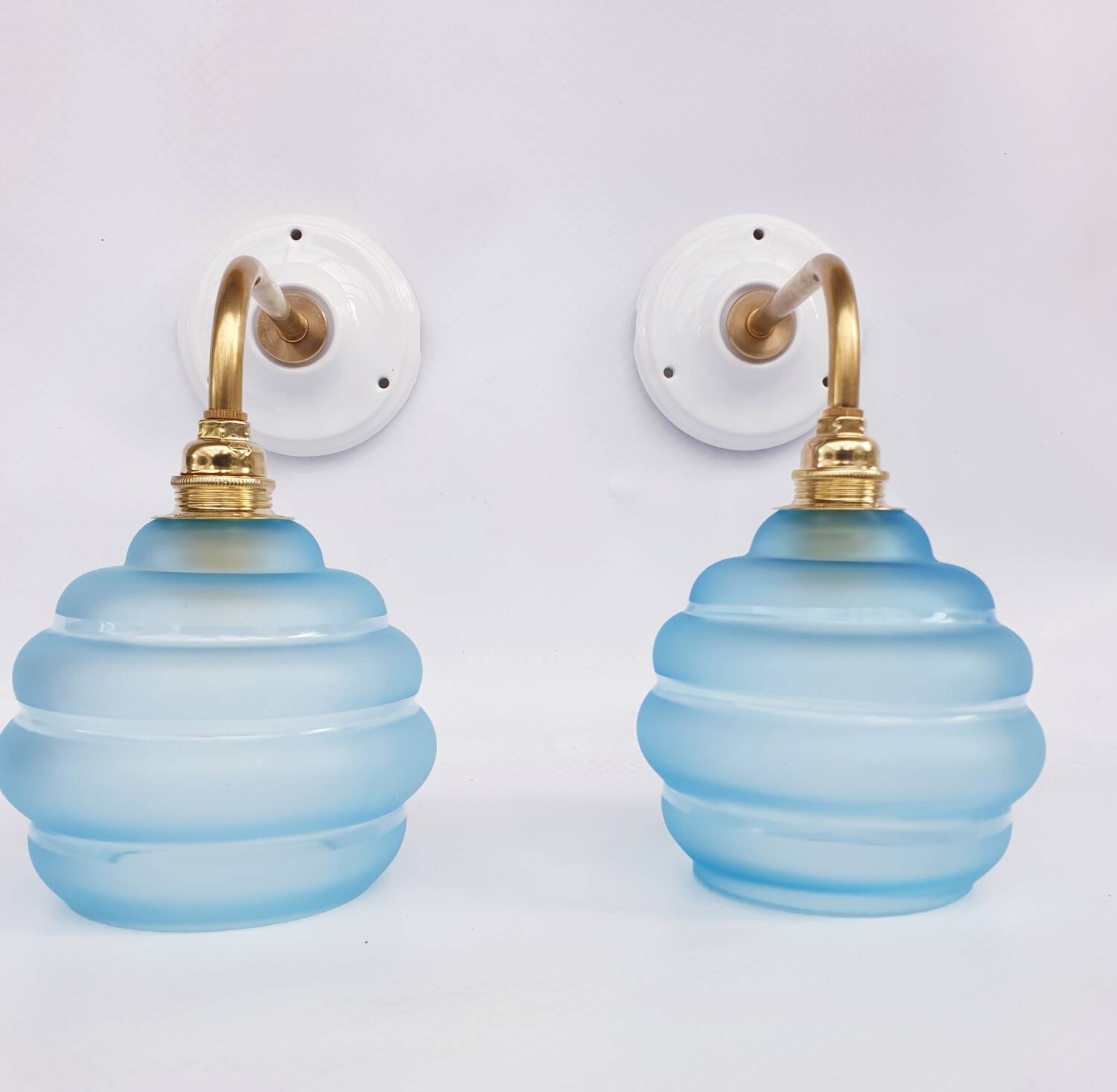 Vintage brass and blue glass wall lights