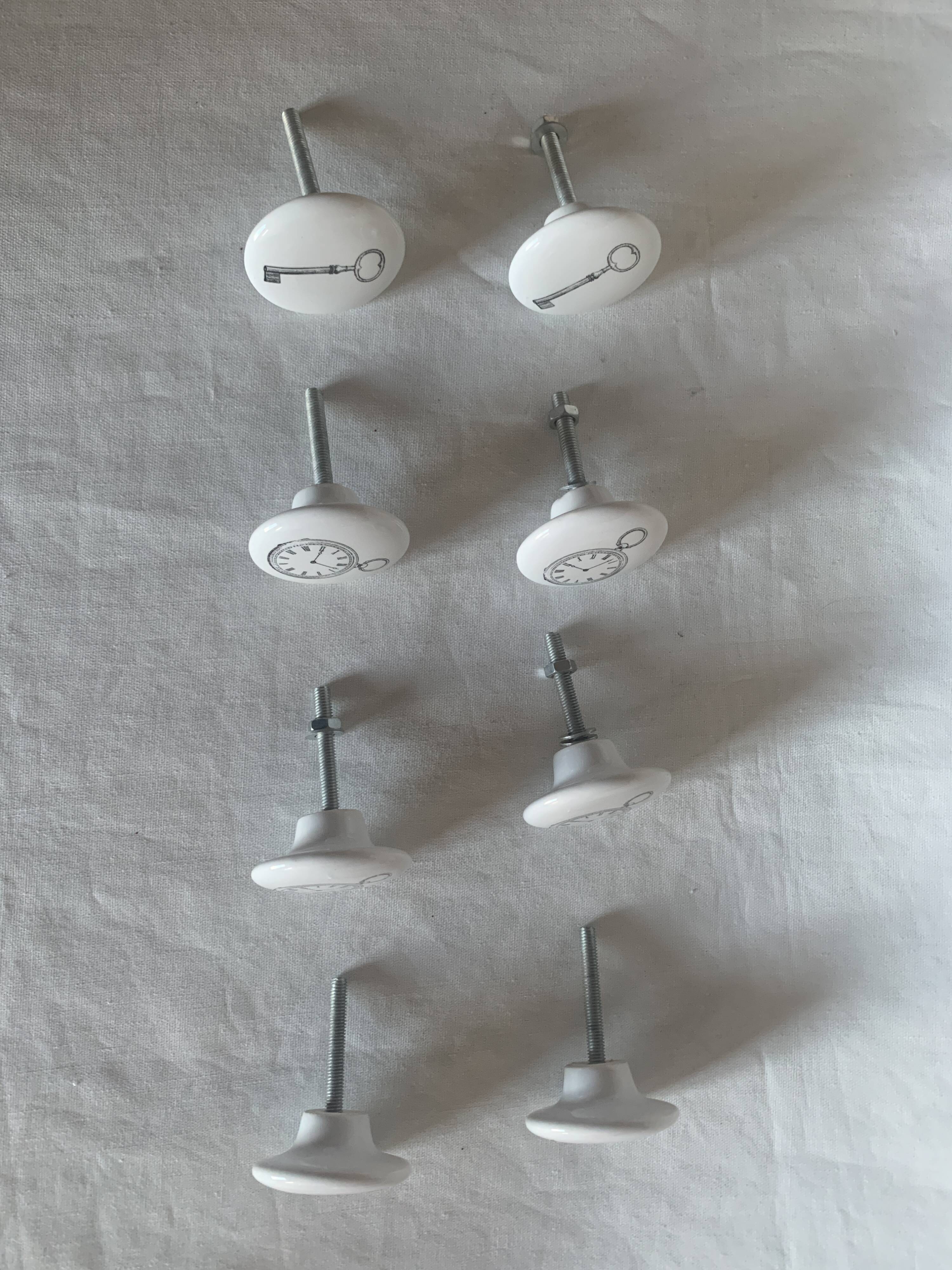 white ceramic door knobs with illustration