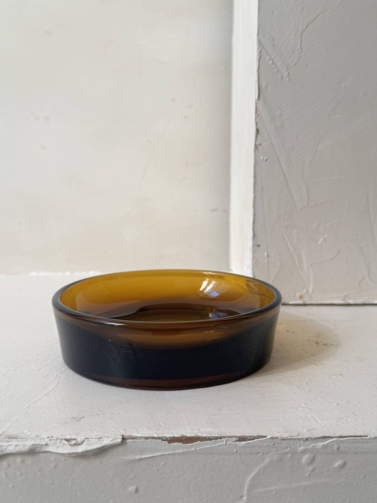 Smoked glass catchall fully tinted in amber.