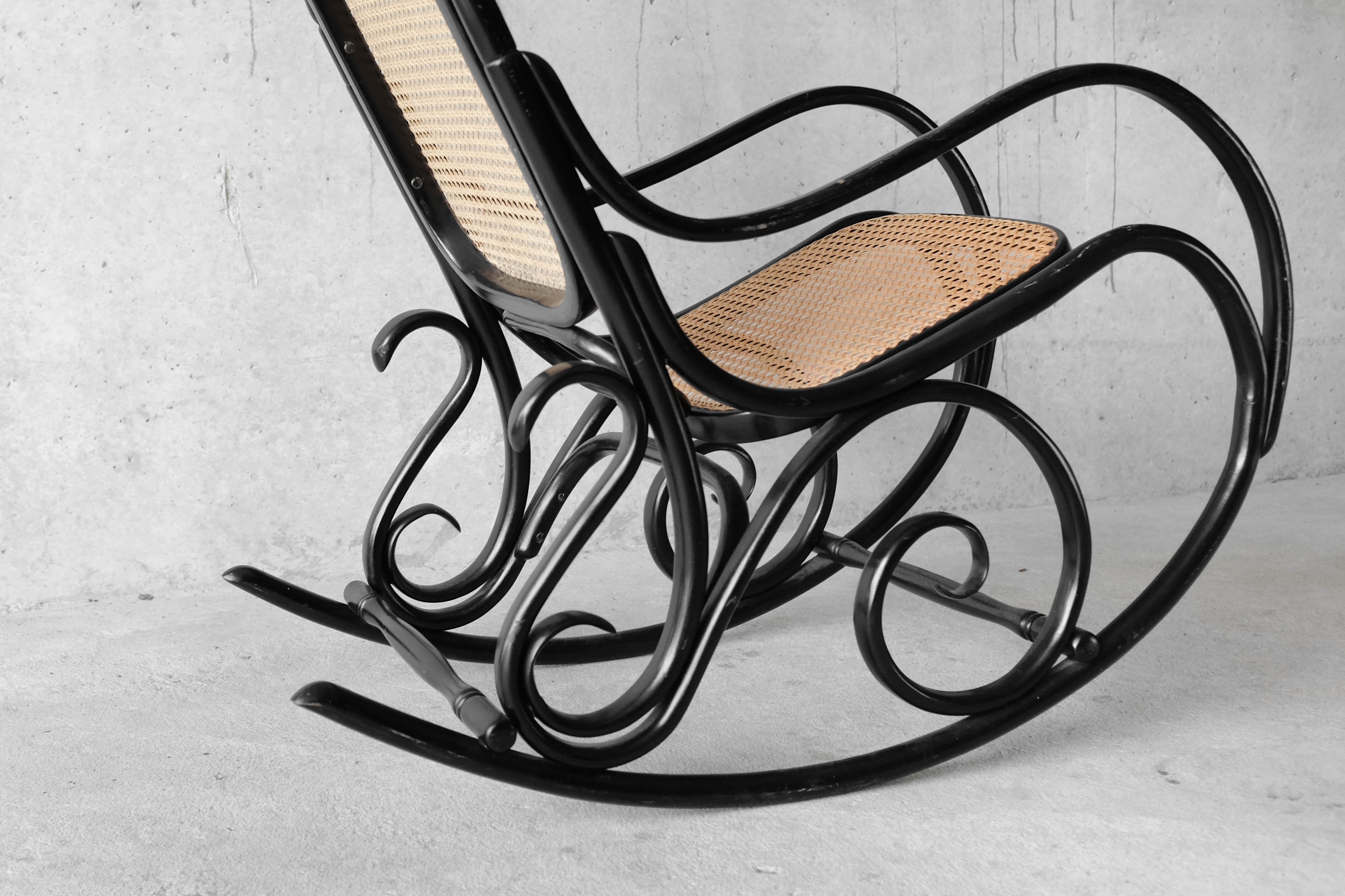 Black rocking chair in curved wood, years 50