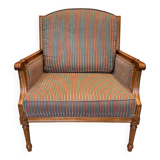 Armchair in the style of Louis XVI made of solid wood, striped fabric.