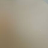 Vintage frosted glass lamp, round globe, elegant design, soft light.