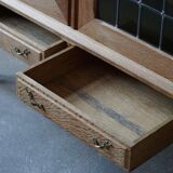 20th-century mid-century solid oak sideboard with glass front, by a Danish cabinetmaker.
