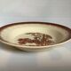Earthenware plate from Moulin des Loups with stencil pattern.