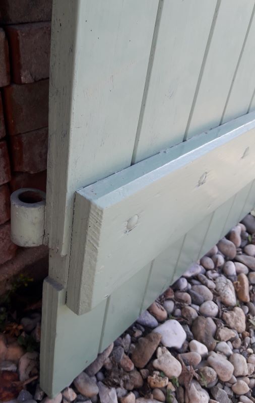 Pair of wooden shutters hanging iron