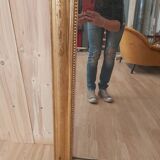 Golden Louis Philippe mirror with golden leafy