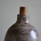 Ceramic bottle vase with a fish signature to be identified.