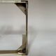 Set of three nesting side tables in brass and smoked mirror.