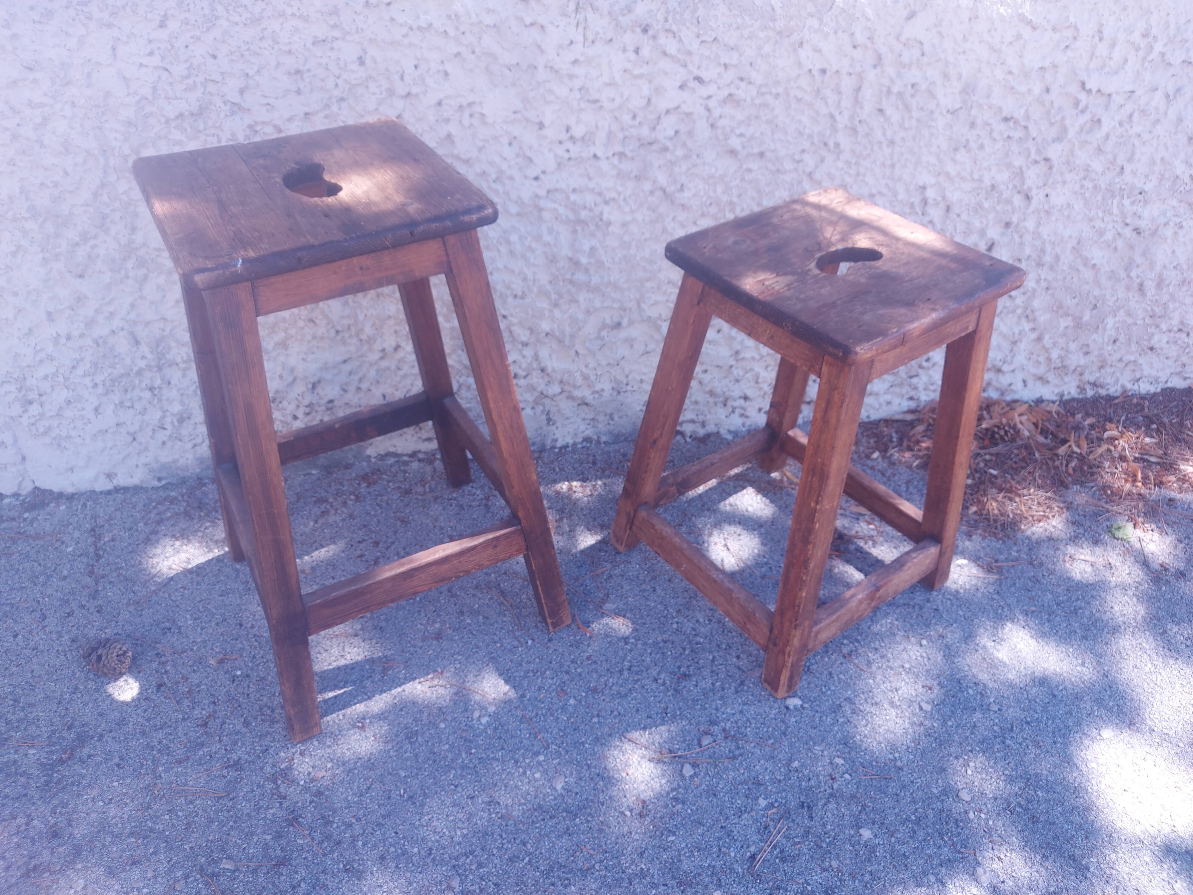 Two vintage wooden stools