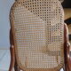 Rocking-chair in turned wood and cannage
