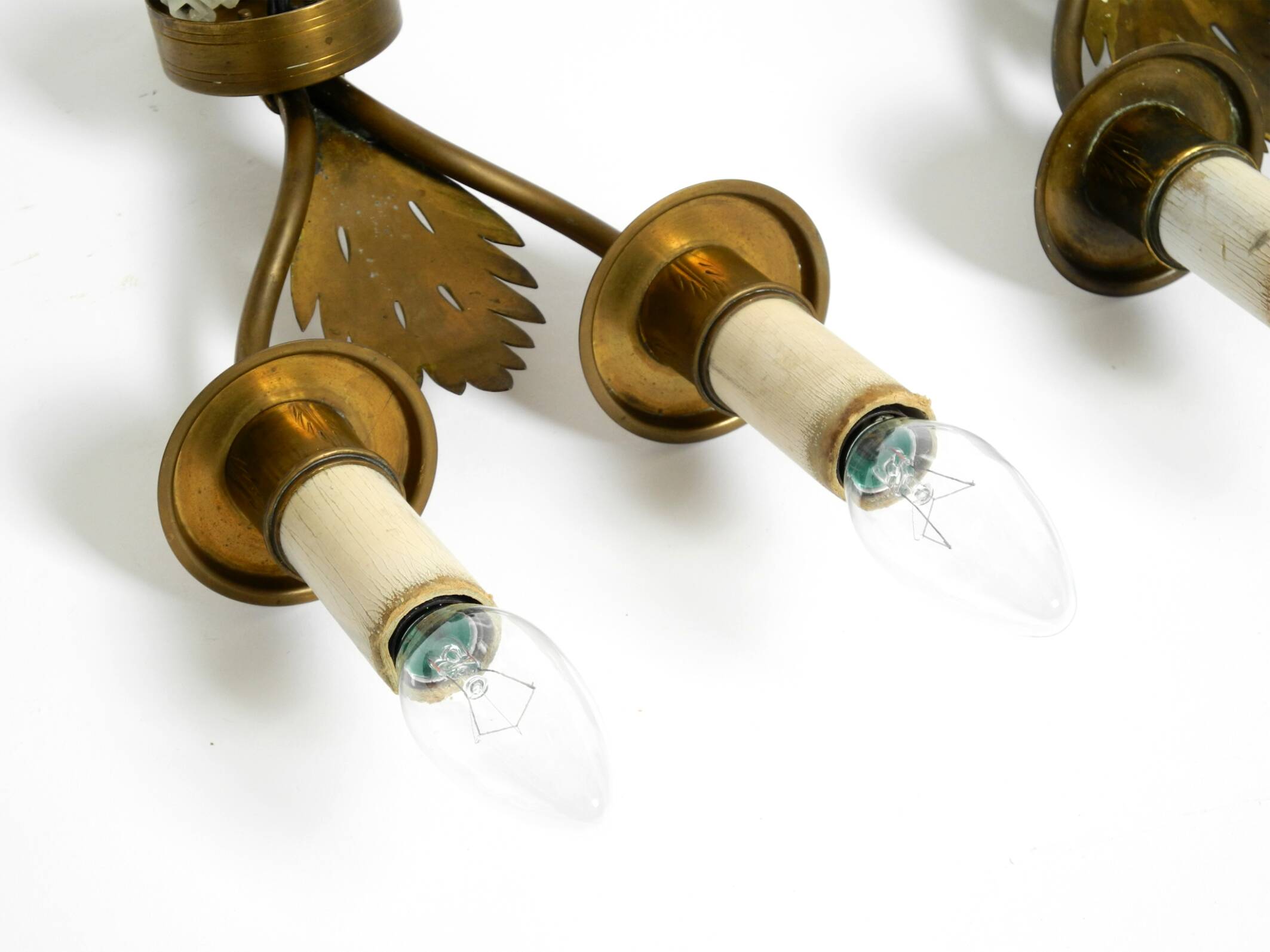 A pair of mid-century modern brass wall lamps by Vereinigte Werkstätten