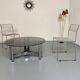 Round coffee table in smoked glass and chrome steel, 1970s design.
