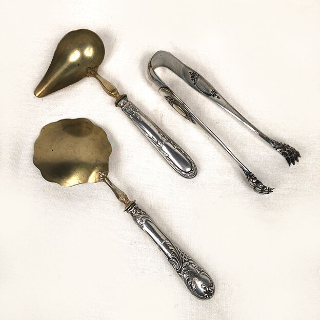 Set of three silver metal service cutlery