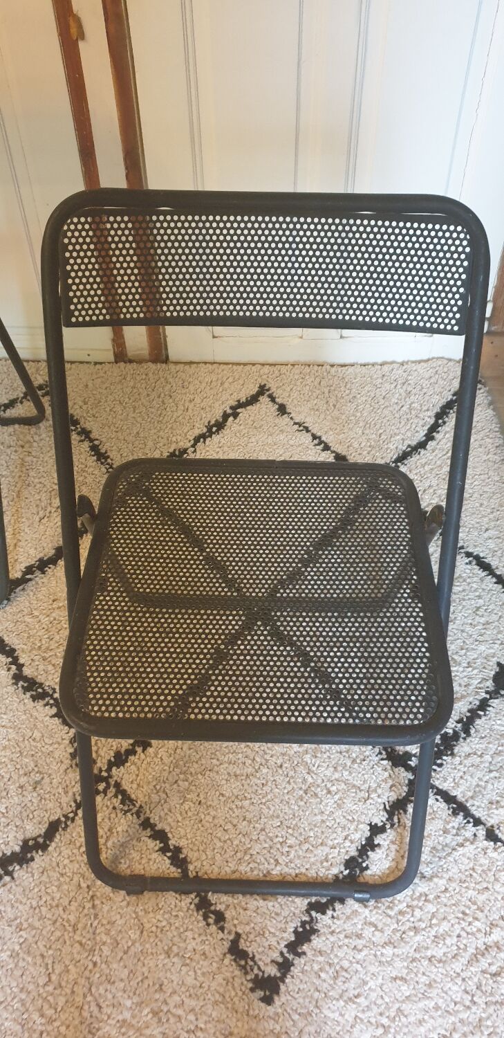 Pair of folding chairs in perforated metal