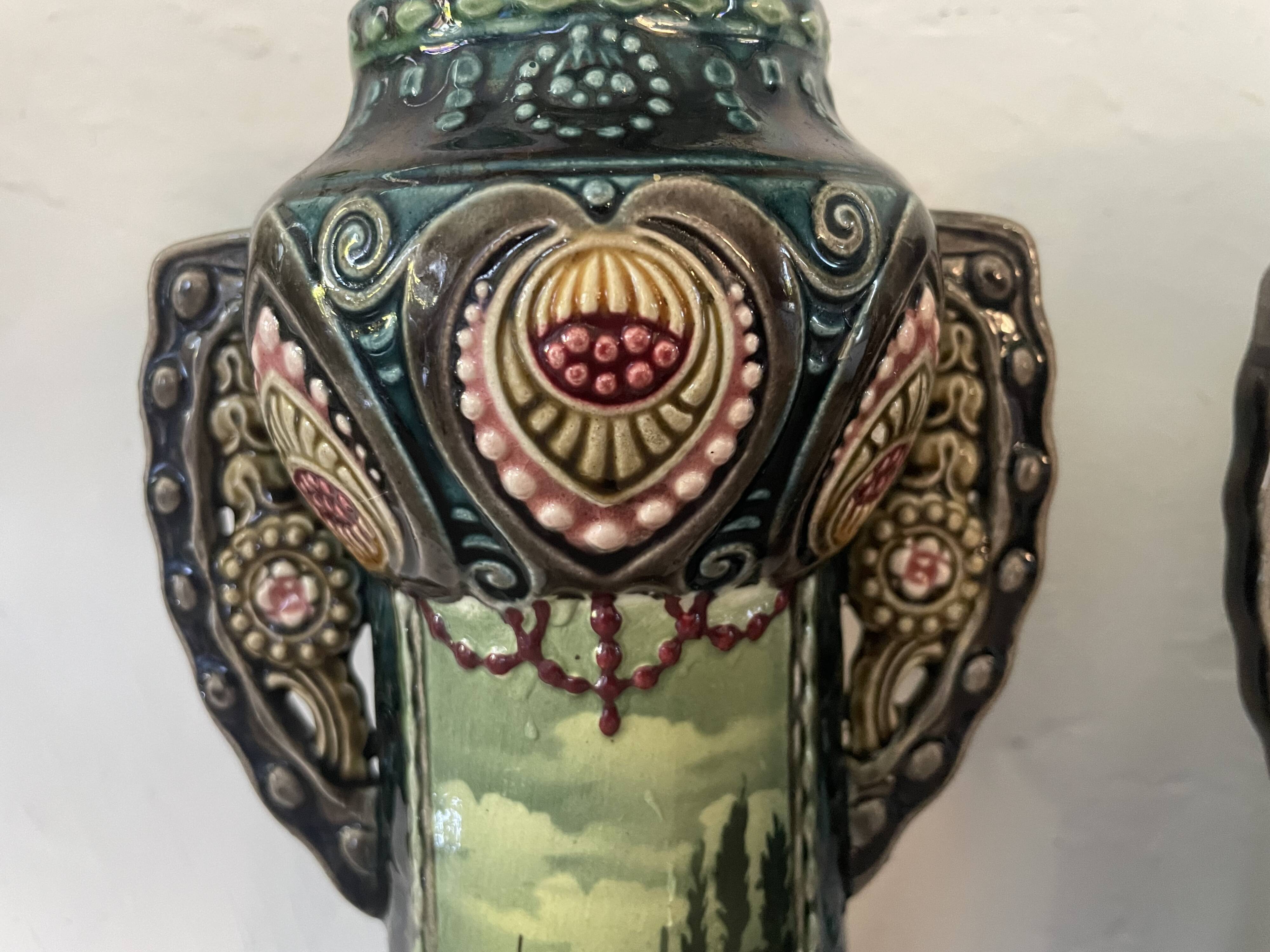 Pair of Art Nouveau slipware vases, hand-painted decoration.