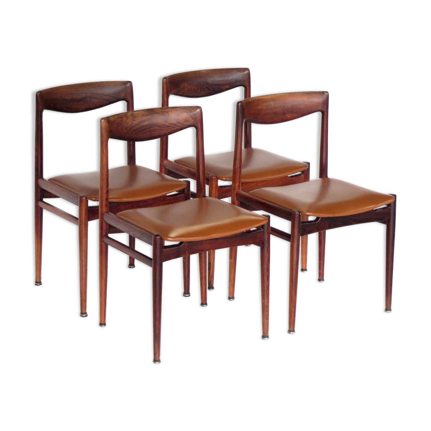 Set of four vintage mid century rosewood dining chairs with cognac leather seats