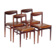 Set of four vintage mid century rosewood dining chairs with cognac leather seats