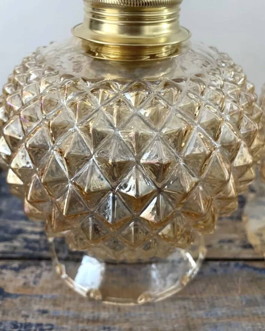 Pair of golden globe wall lights