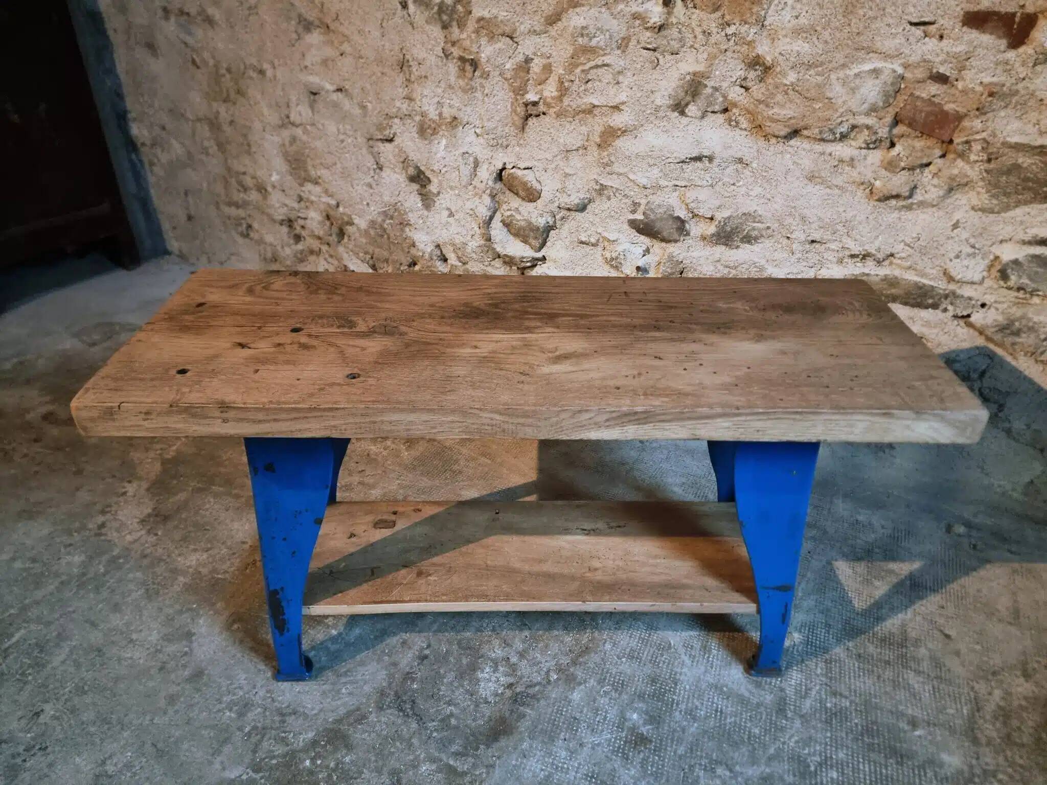 Vintage industrial workbench table with cast iron legs (Aux Forges de Vulcain)