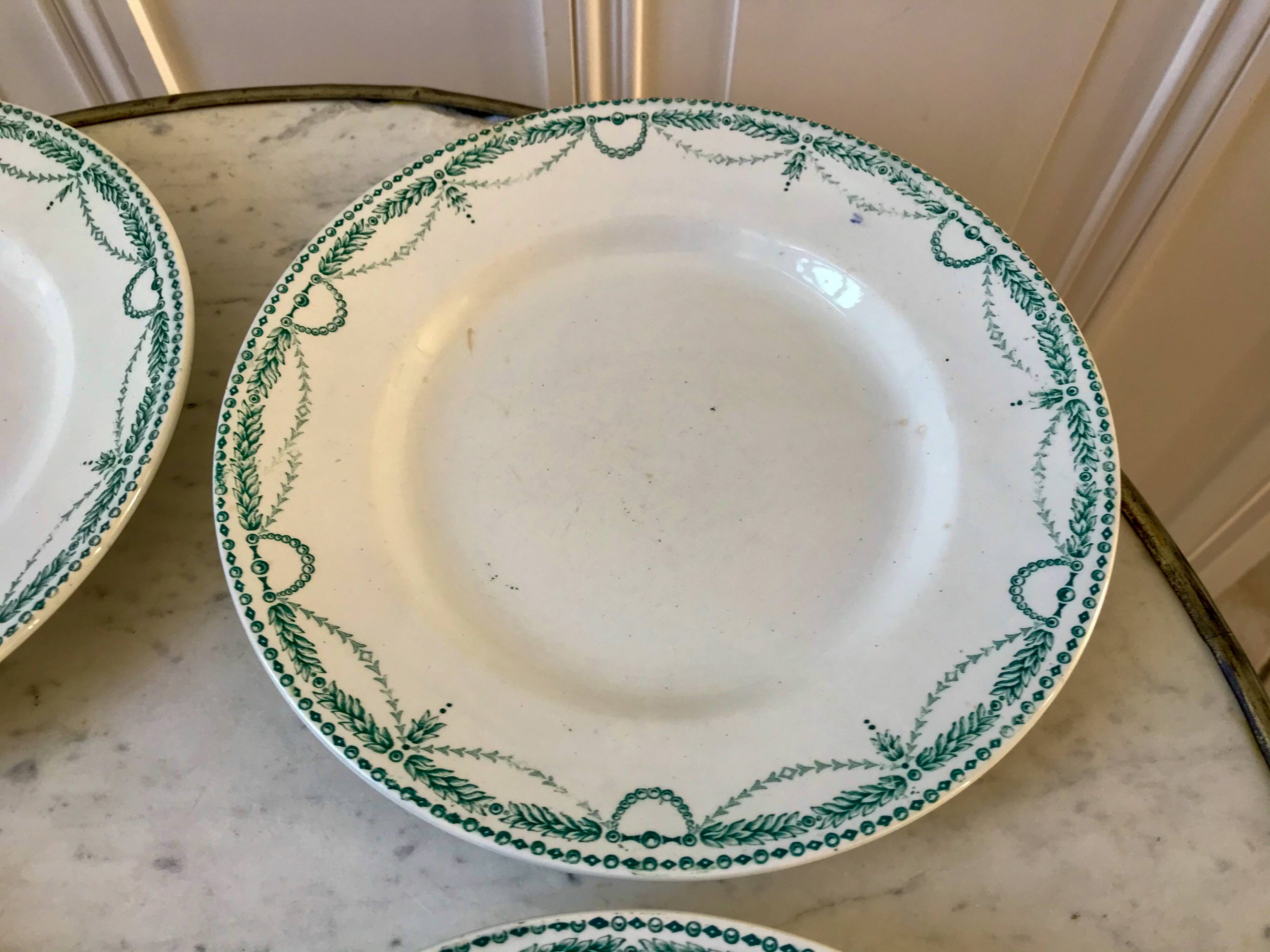 set of 4 flat plates in Terre de Fer Saint Amand model René 19th century