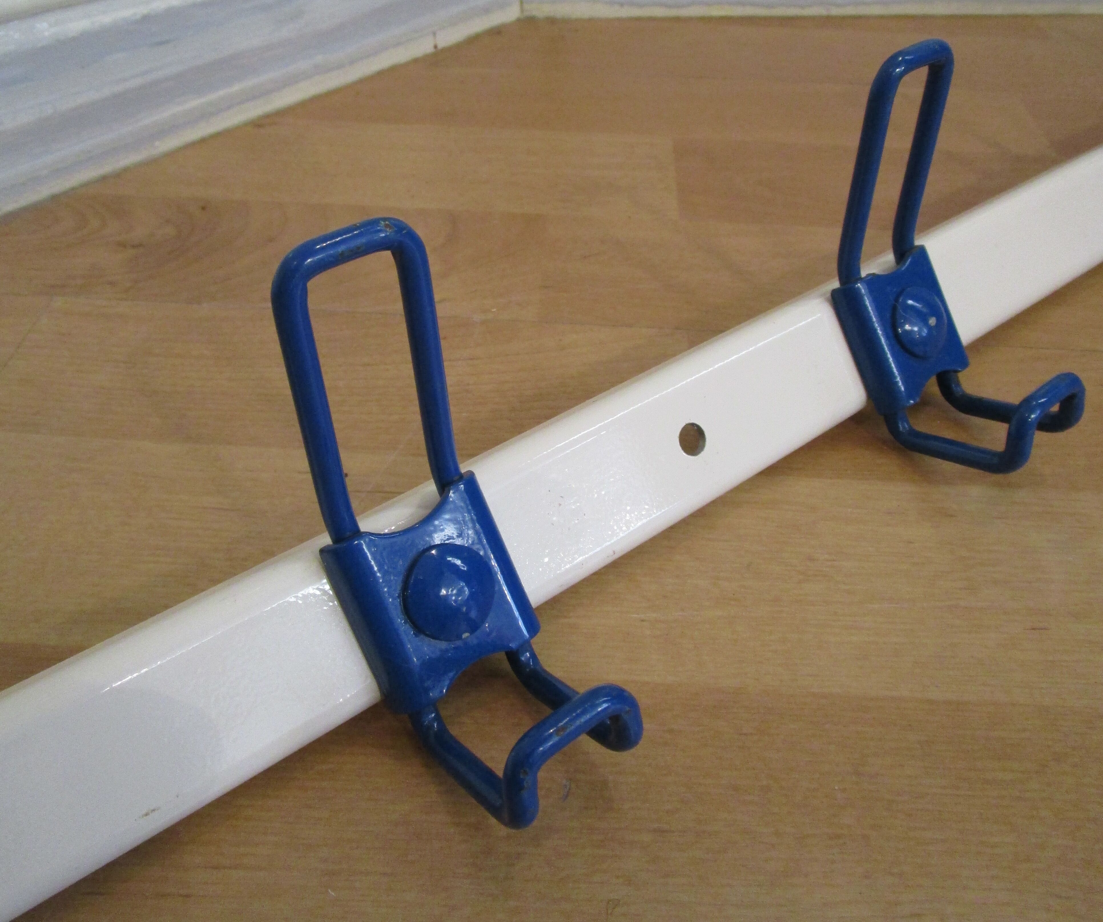 White and blue lacquered steel wall coat holder