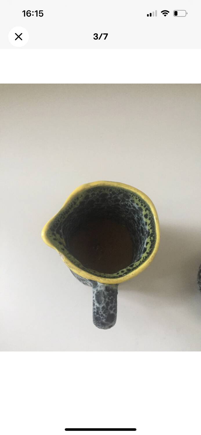 Set of two small Vallauris yellow and black milk jugs