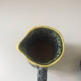 Set of two small Vallauris yellow and black milk jugs