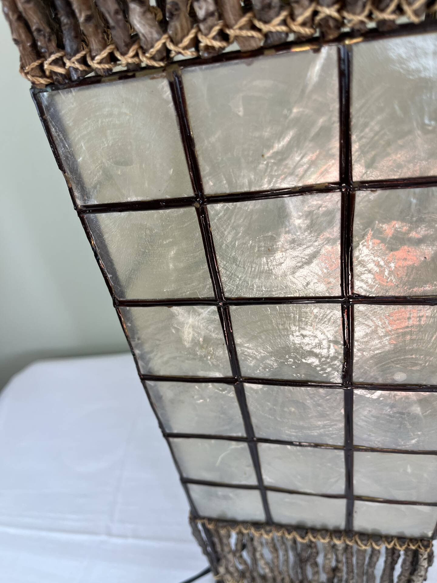 Capiz shell lamp and woven twigs