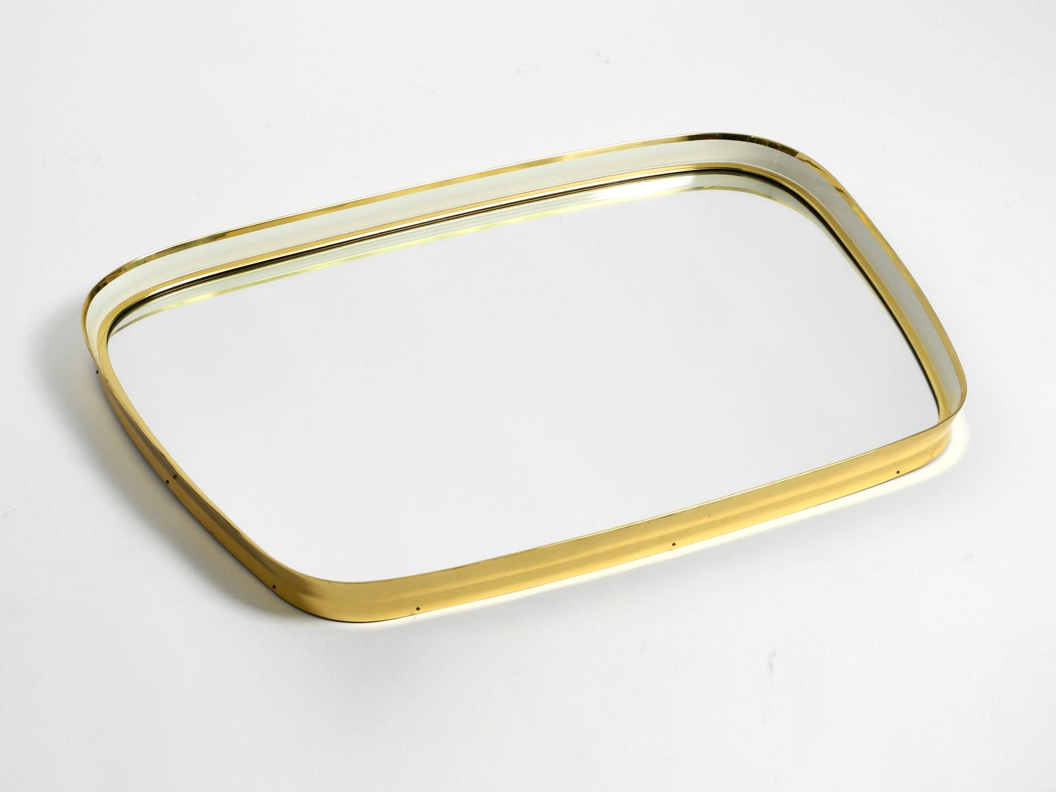 Huge Mid Century "Zier-Form" wall mirror with heavy brass frame with Label