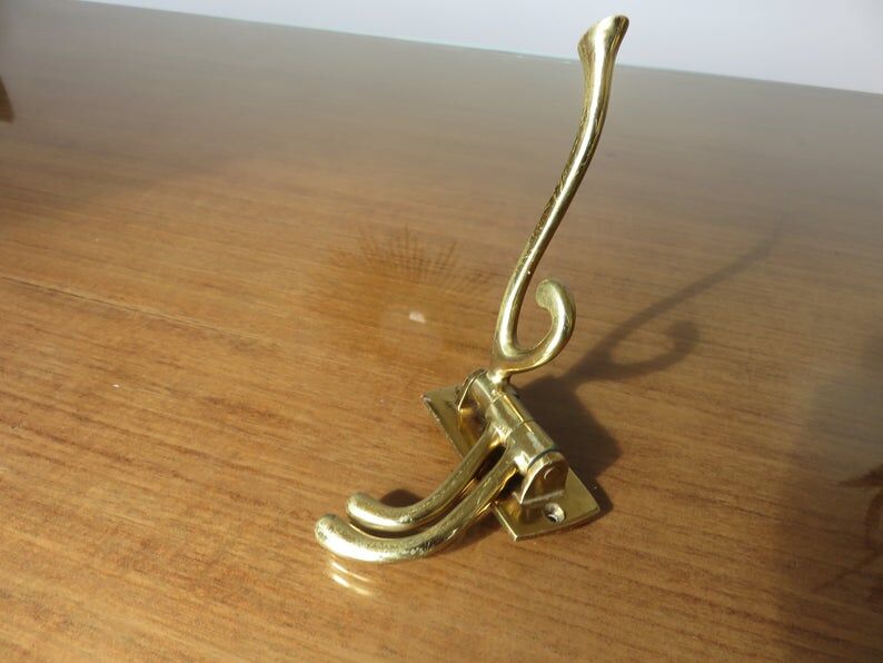 70s brass swivel coat door