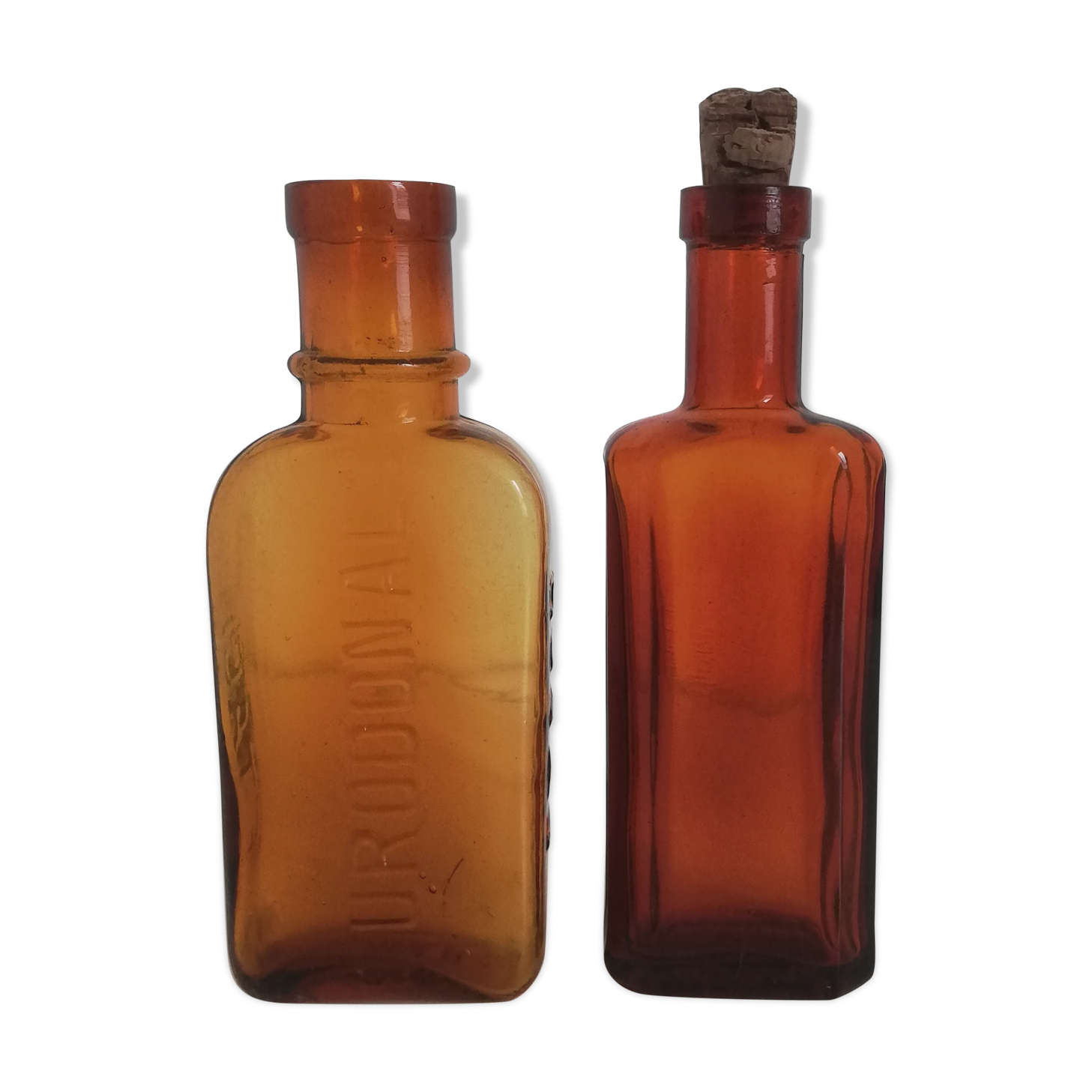2 amber apothecary bottles