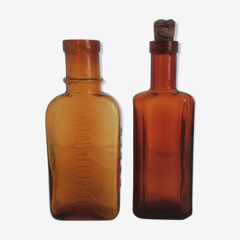 2 amber apothecary bottles