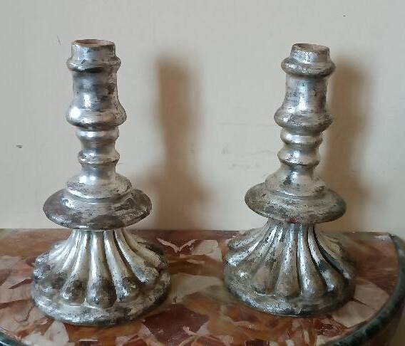 Rare pair of antique silvered terracotta candlesticks from the 17th century.