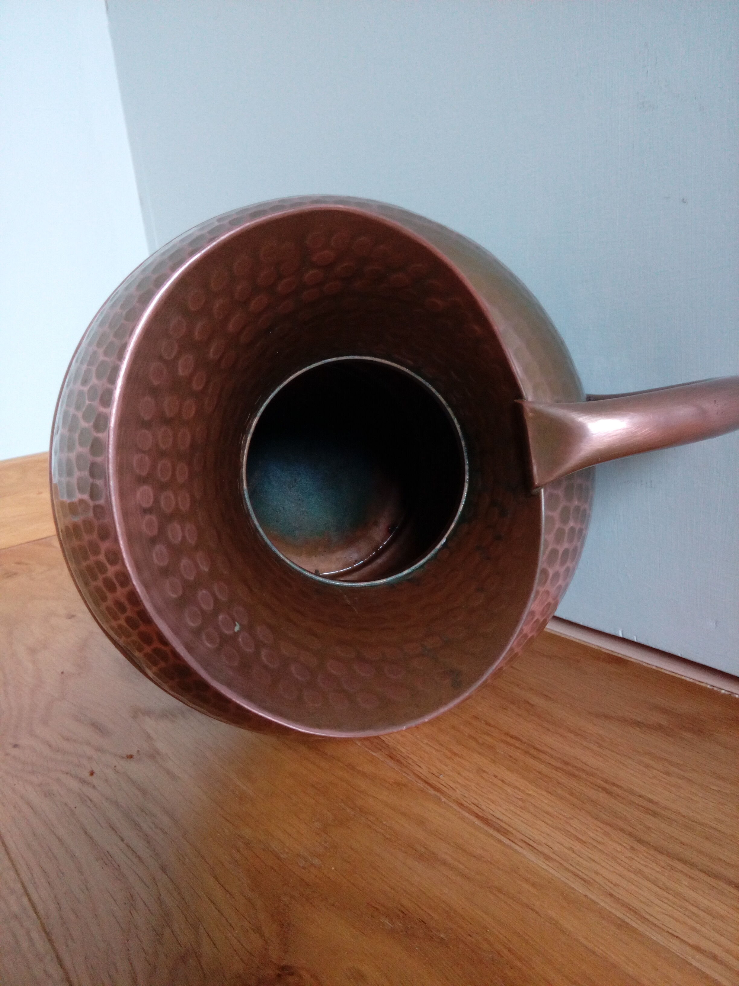 Dented copper vase or jug