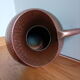 Dented copper vase or jug