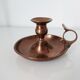 Set of a pair of candle holders and a hand candle holder