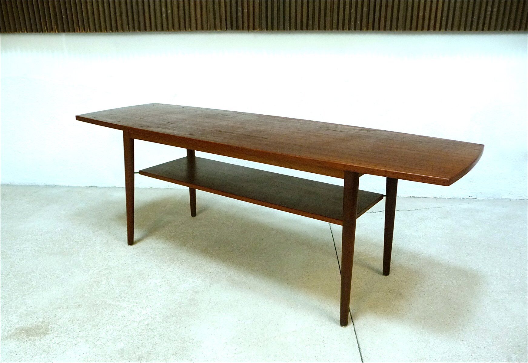 Curved Danish teak coffee table with additional shelf compartment, 1960s