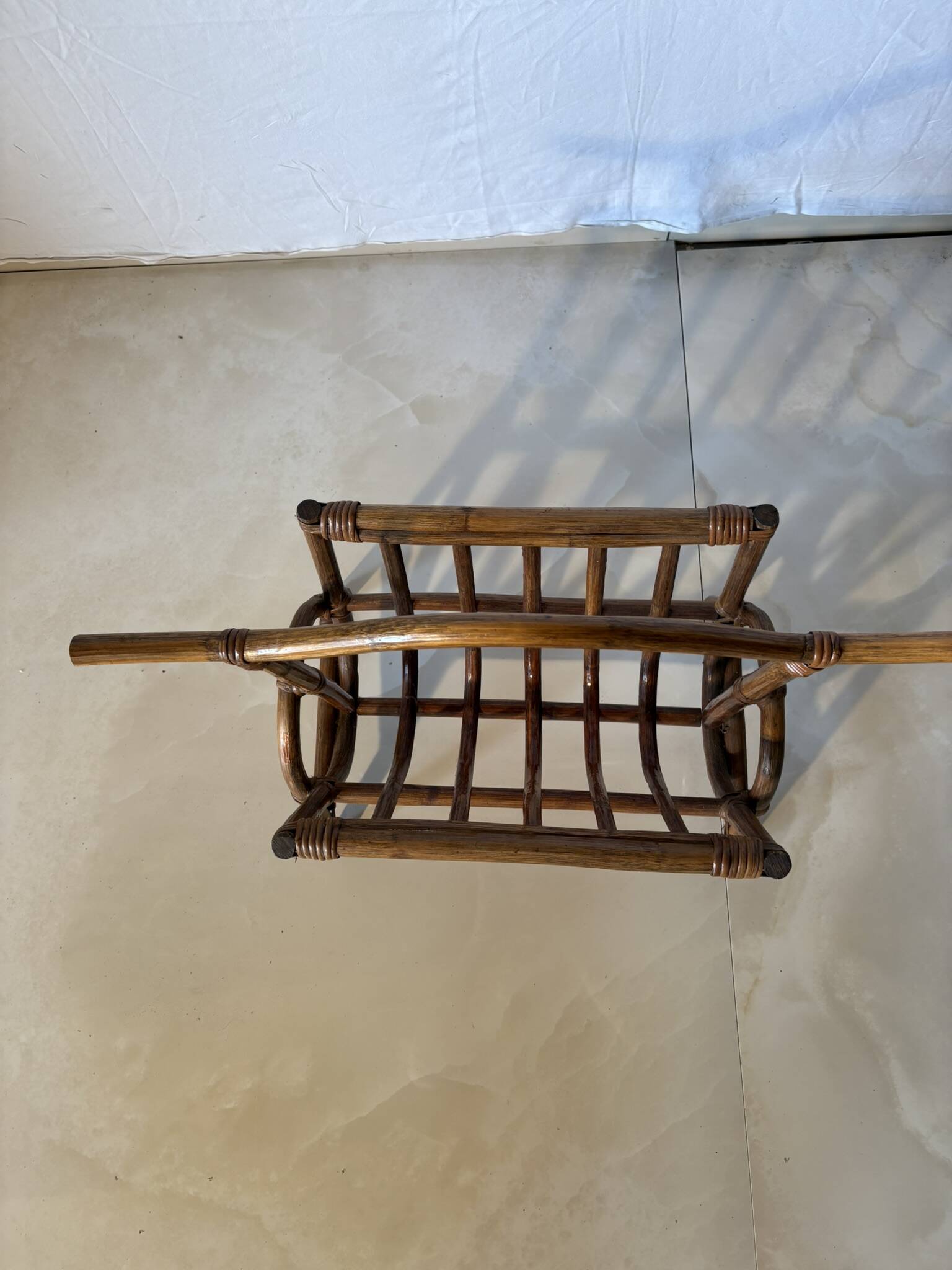Vintage rattan magazine rack – natural curves and bohemian spirit