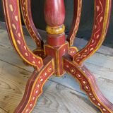 Pedestal table in polychrome wood and gold metal veneer