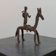 Hand-forged Dogon tribal figurine from naive East Africa.