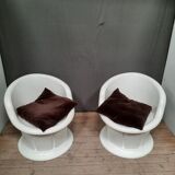 Pair of white plastic armchairs