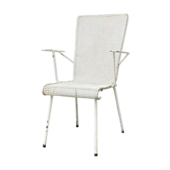 Perforated metal armchair