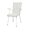 Perforated metal armchair