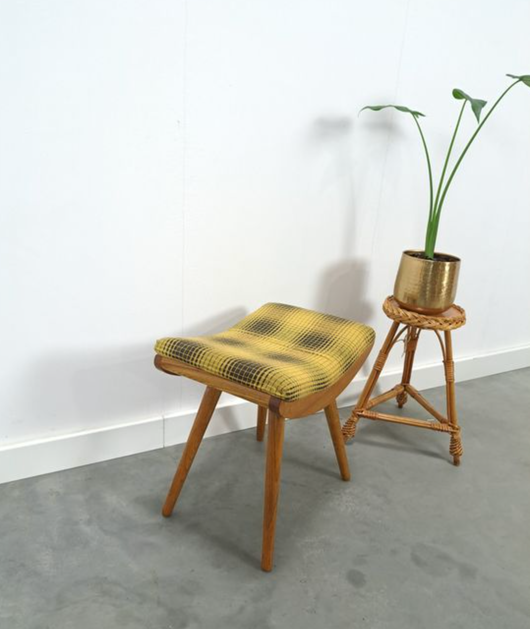 Vintage footrest with checkered cushion